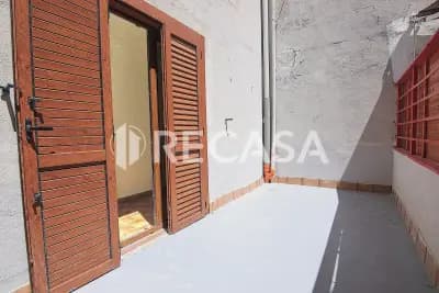 Appartamento con box e locale commerciale